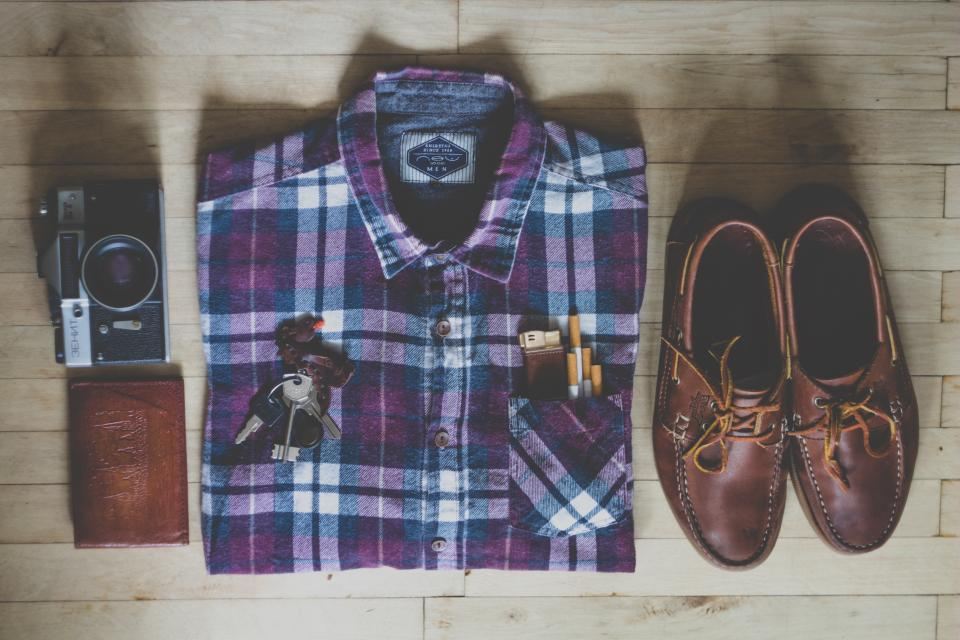 Heritage plaid flannel shirt laid flat with leather shoes